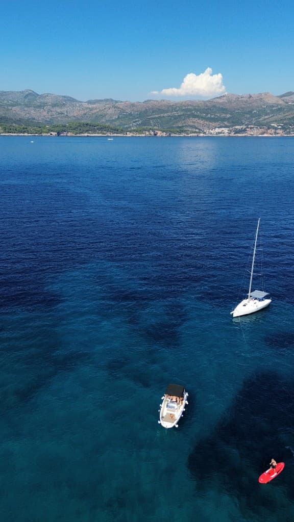 Speedboats on turquoise Adriatic water near Dubrovnik