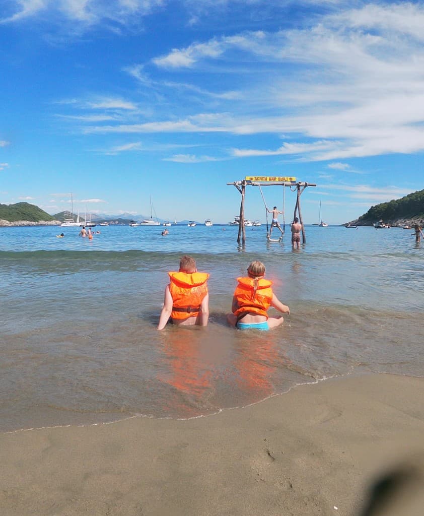 Guest relaxing on an inflatable in clear Adriatic water