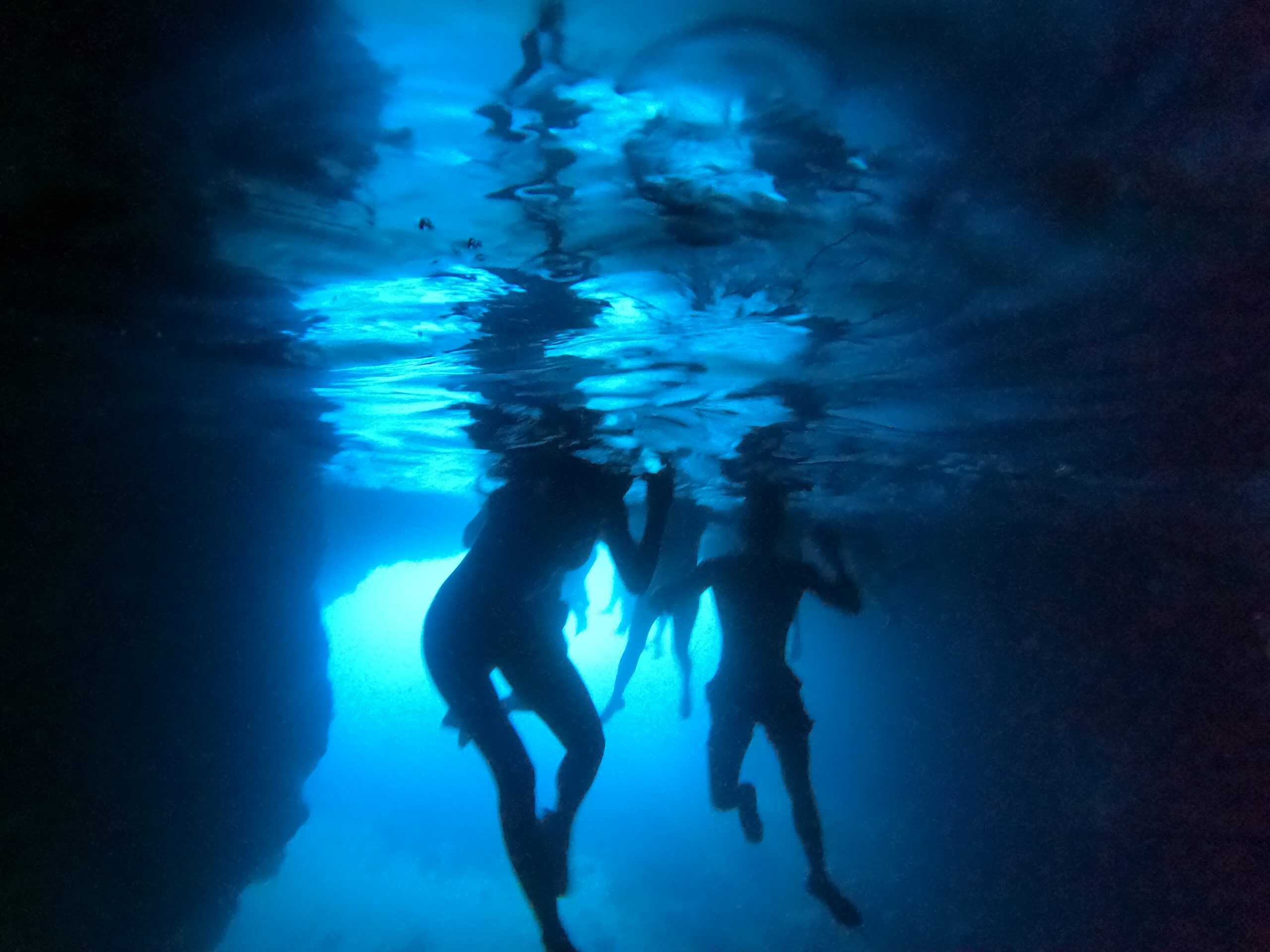 Swimming inside the Green Cave with emerald light