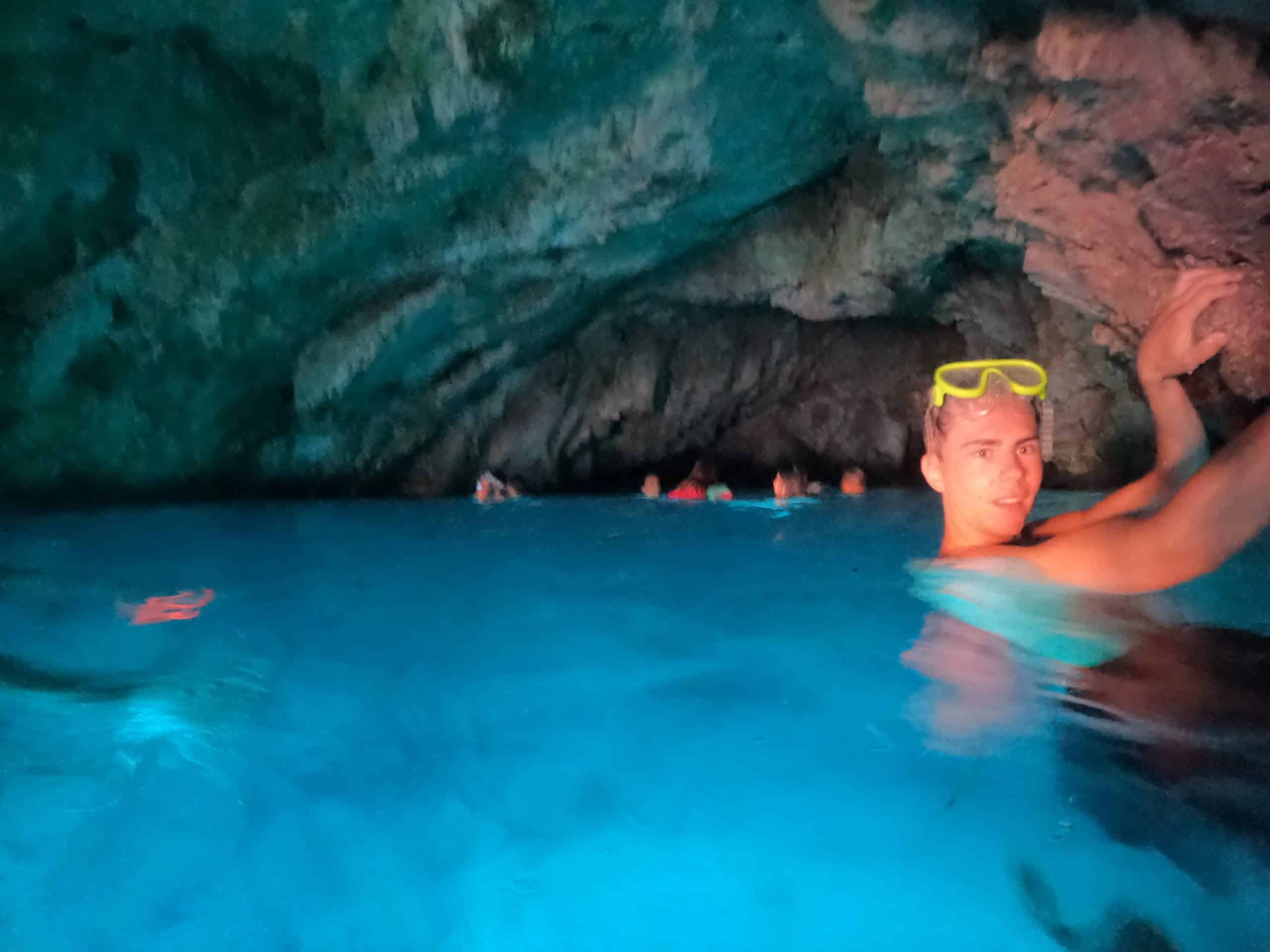Snorkeling in turquoise waters near caves